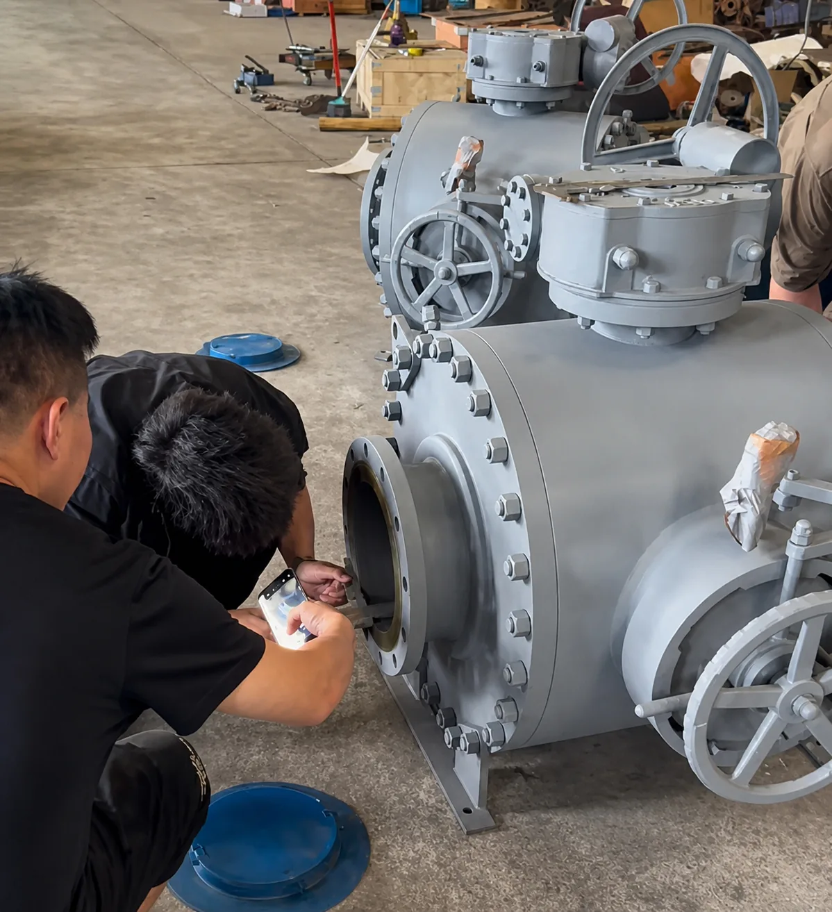 Technicians carrying out dimensional inspection on industrial valves