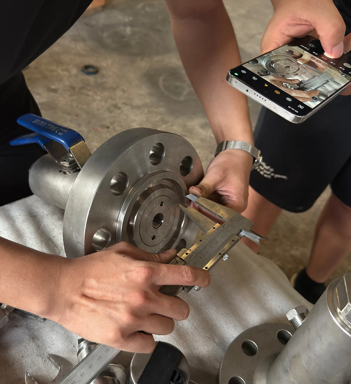 Close-up dimensional measurement of a valve component with a caliper