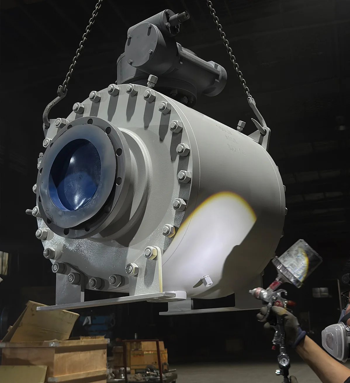 Protective coating being applied to a large industrial valve body