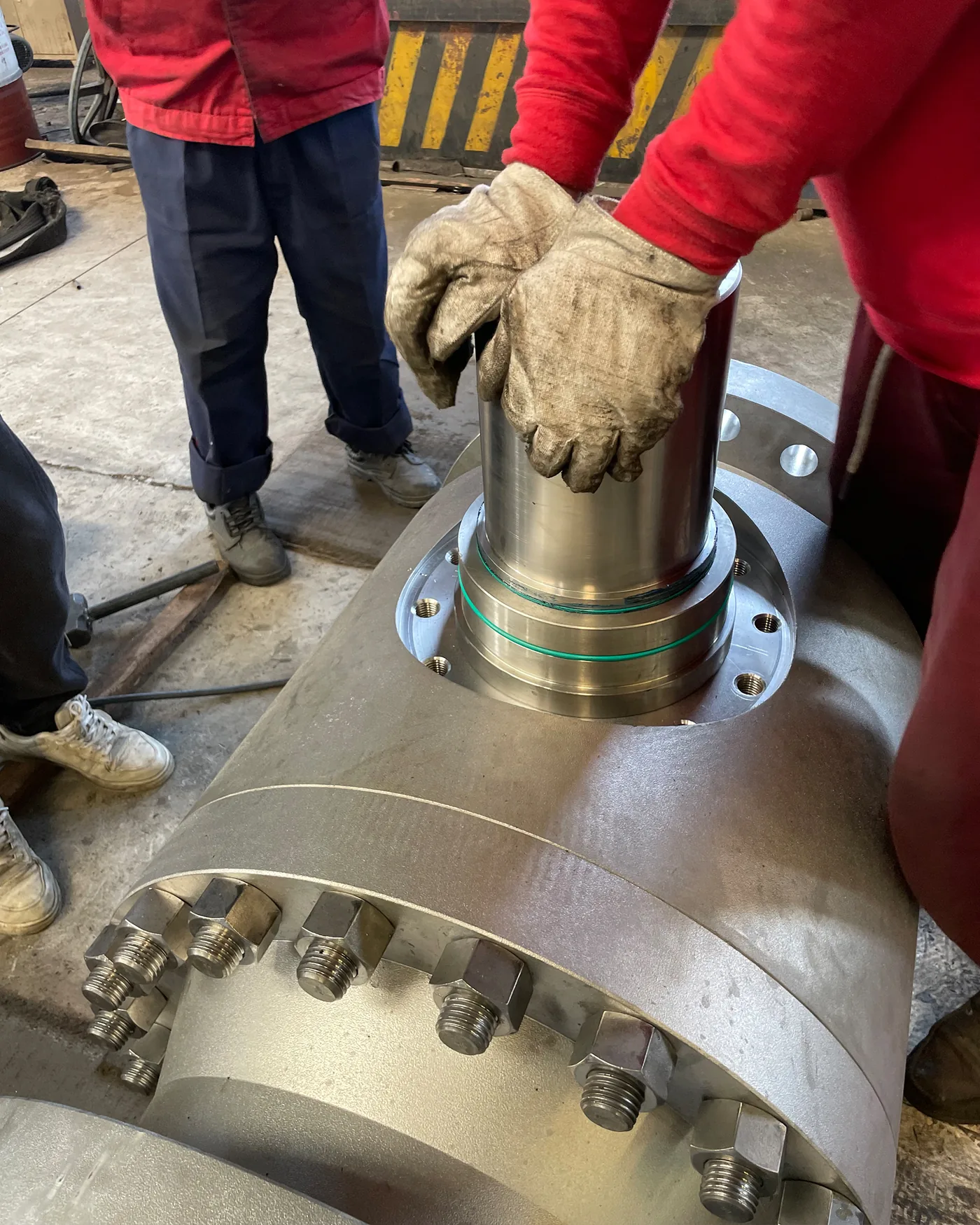 Technician installing internal components during industrial valve assembly